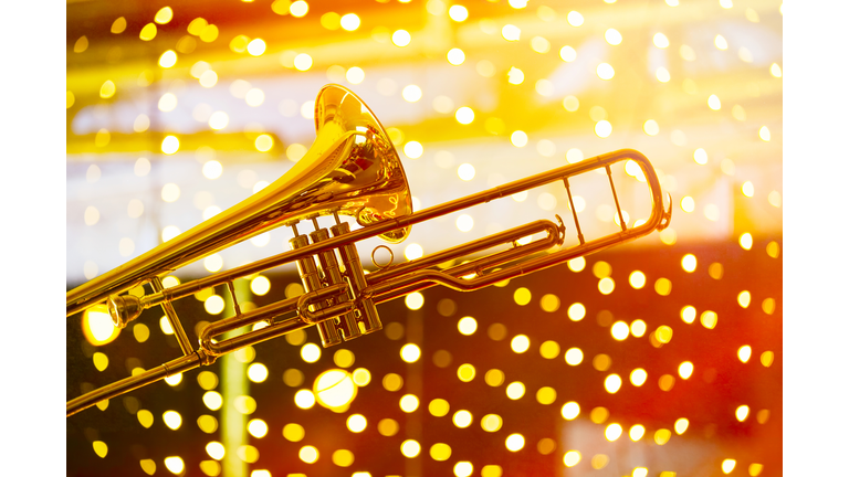 Trumpet in musical lights abstract background