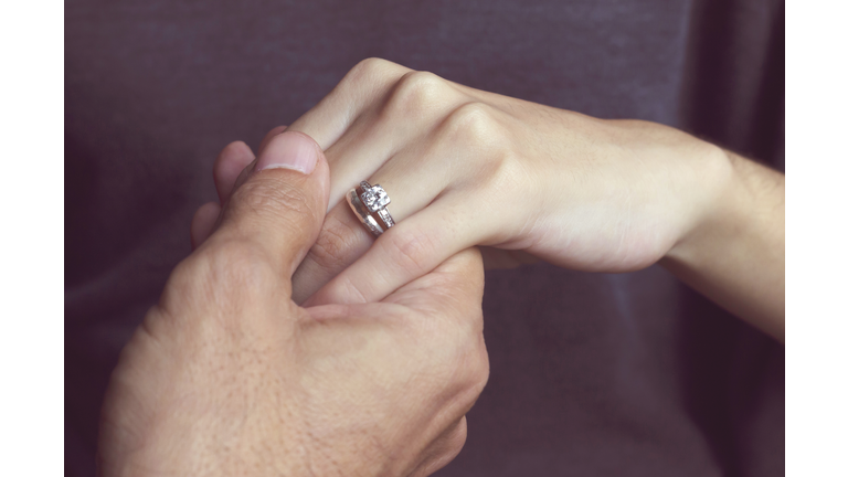 Holding Hands with engagement ring