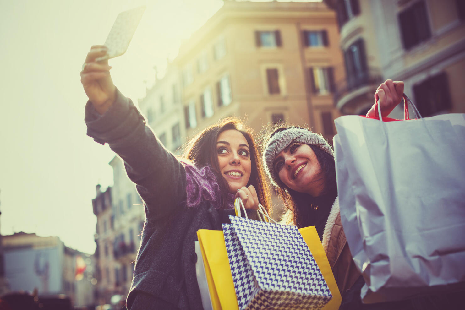 Women take a selfie during christmas shopping in Rome