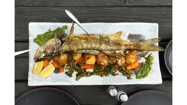 Whole baked fish with vegetables