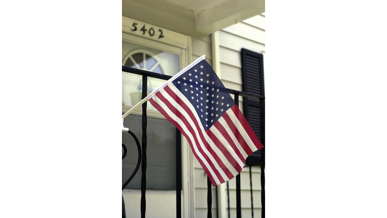Small American Flag Flies On The Porch Of Asmaa Al Themair's Home