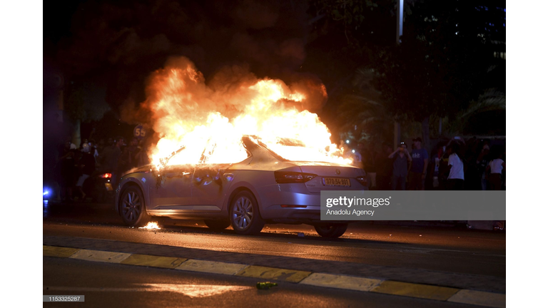 VIDEO SHOWS MAN RUNNING TOWARD BURNING CAR TO SAVE THE DRIVER.  SEE THE HERO IN ACTION.