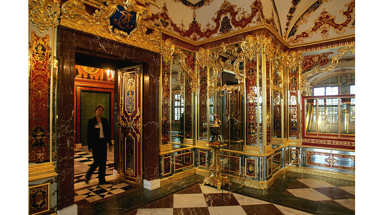A woman enters the Jewel room of the Gre