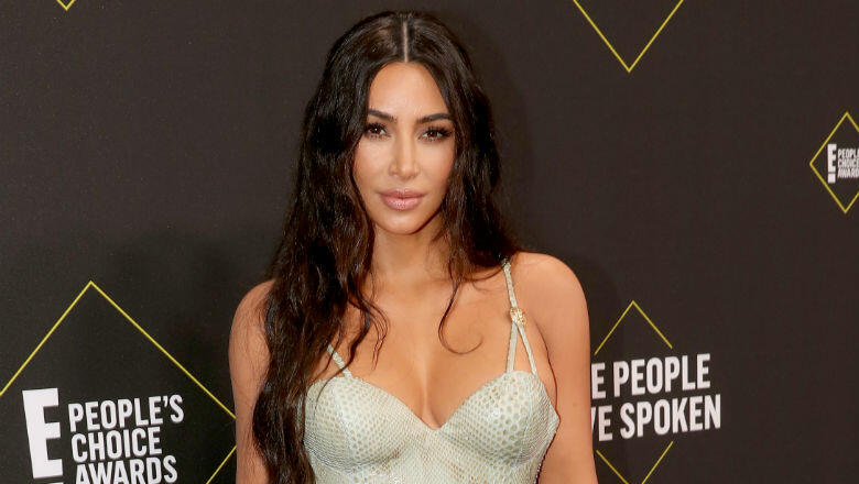 Kim Kardashian Says She's Over Taking 'Tons' Of Thong Bikini Photos - Thumbnail Image