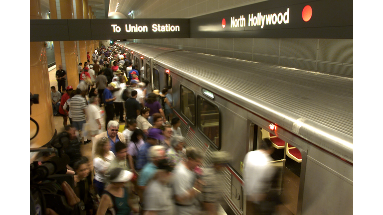 A group at the North Hollywood station files aboard taking advantage of the free rides on the Metro 