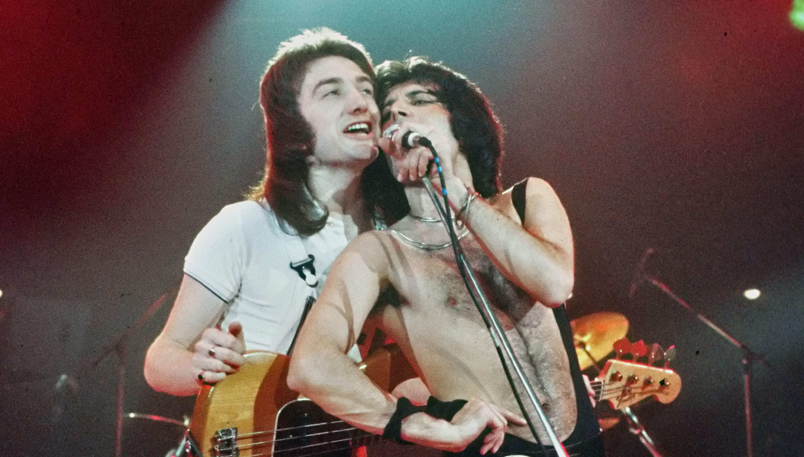 Why Freddie Mercury Believed John Deacon Saved Queen In The '70s | iHeartRadio