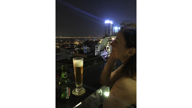 Enjoying a beer on a rooftop bar