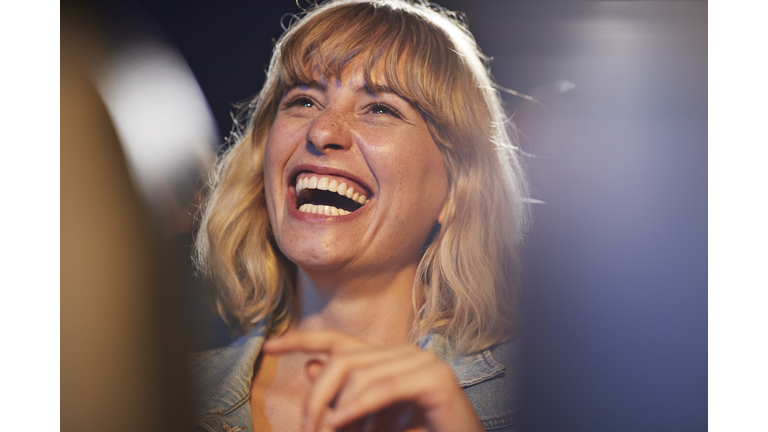 Woman laughing during comedy movie