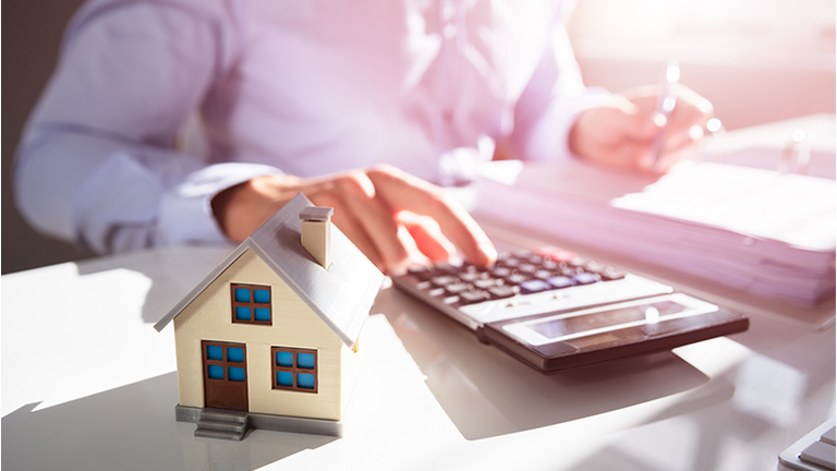 Businessperson Calculating Property Tax