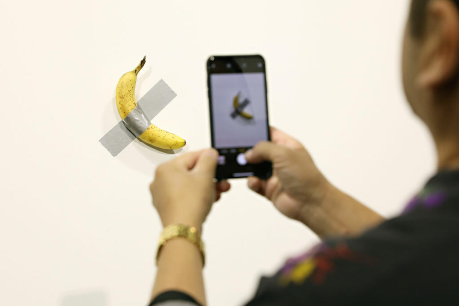 Performance Artist Eats Banana Duct Taped To A Wall That Sold For