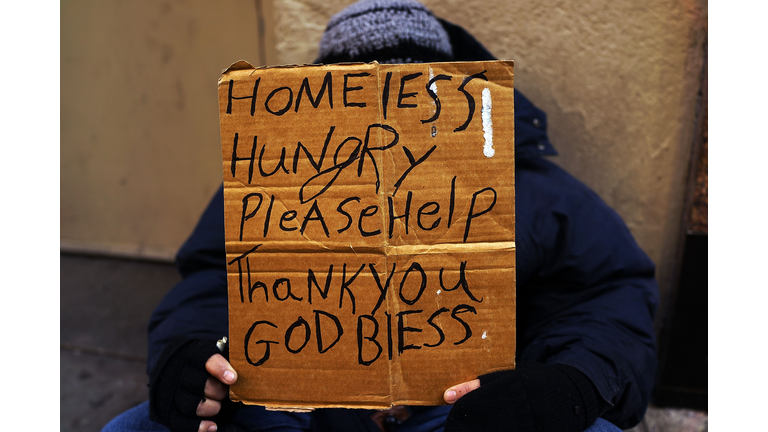 Panhandlers' Placards Show Signs Of Continued Economic Hardship