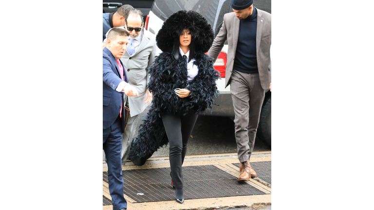 Cardi B's Latest Over-The-Top Courtroom Outfit Featured Feathers & A Train