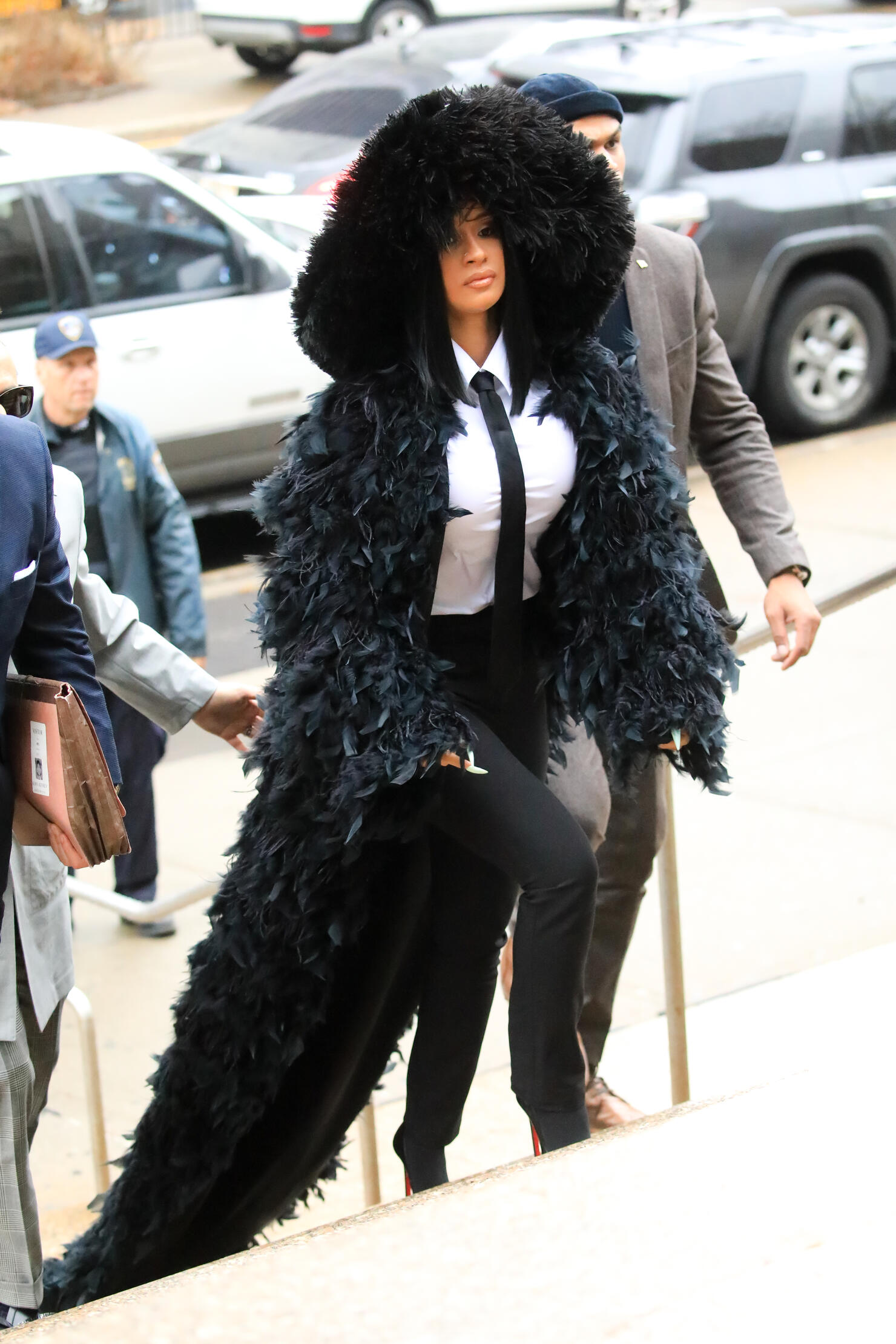 Cardi B's courtroom white coat and skin-tight turtleneck outfit is next  level extra - see photos