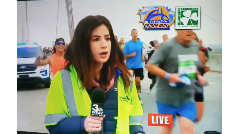 runner smacks reporter's butocks charged