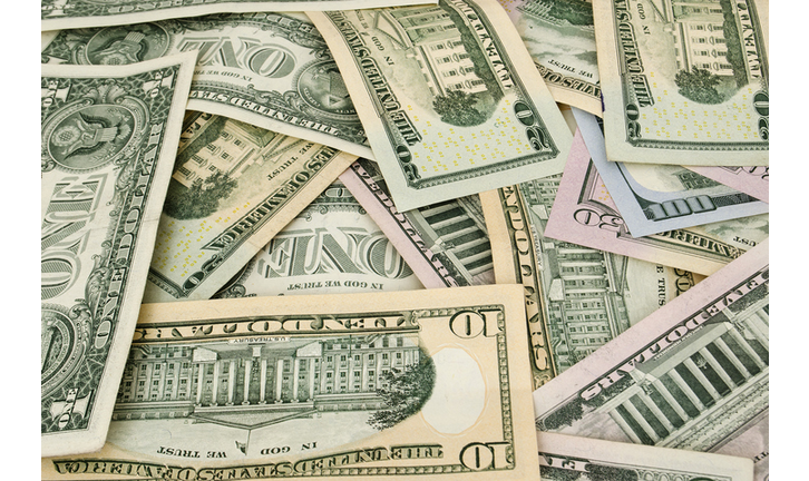 Amarican dollars are scattered with different memorials