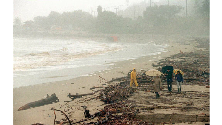 Malibu residents walk along a Malibu, California B