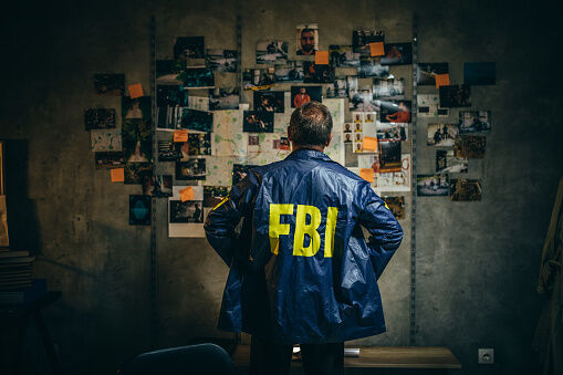 Mature FBI agent works on a case alone