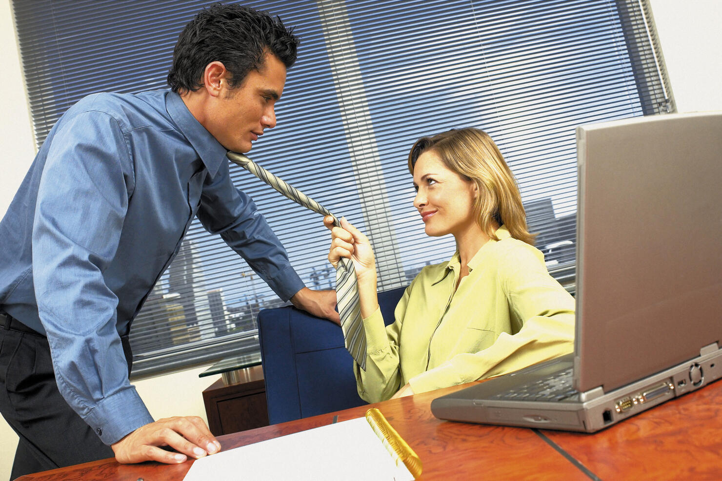 Businessman and businesswoman flirting