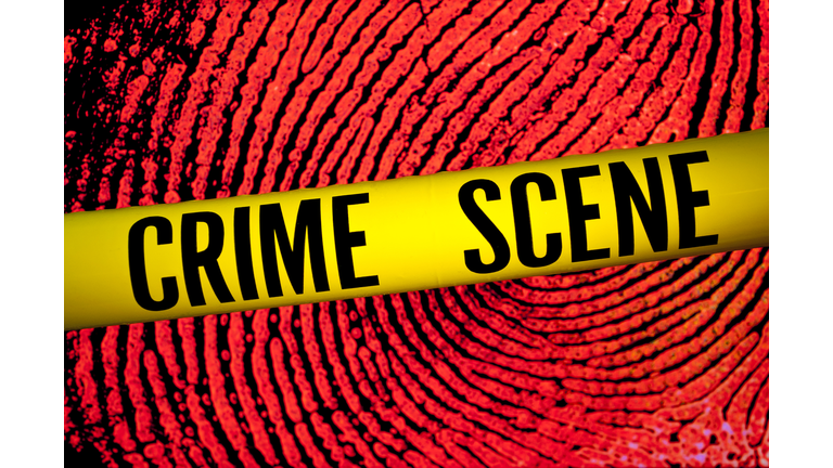 Crime scene tape in front of fingerprint