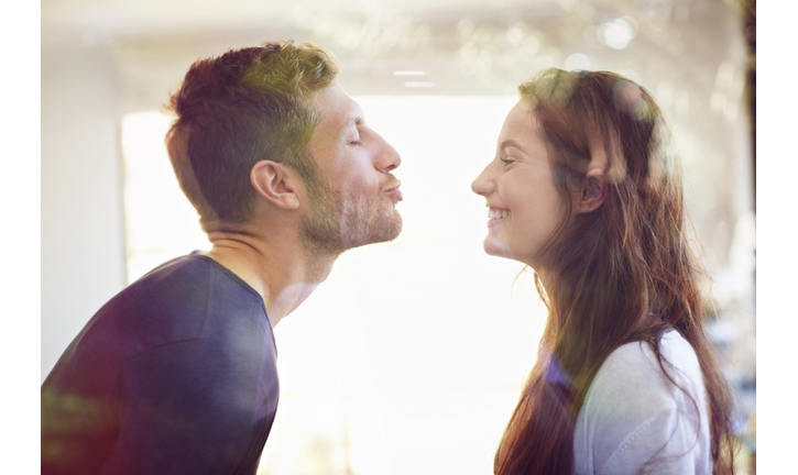 Young couple about to kiss