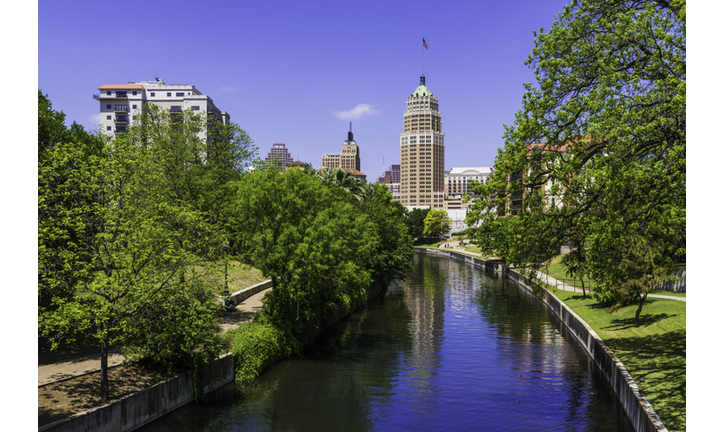 Riverwalk San Antonio Texas skyline, park walkway along scenic canal