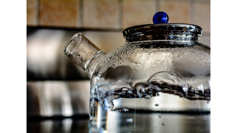 Close-Up Of Water Boiling In Teapot