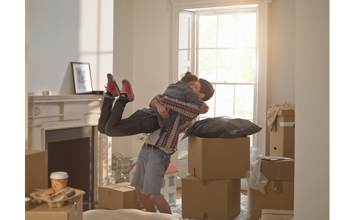 A couple celebrating moving in to a new home