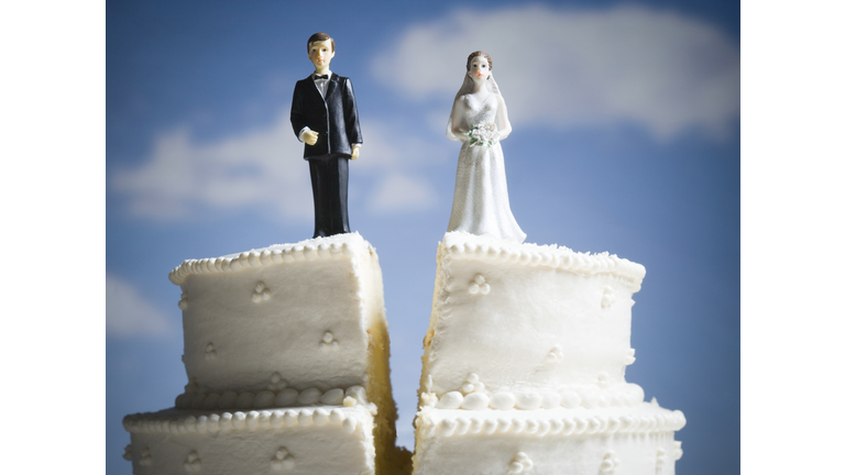 Wedding cake visual metaphor with figurine cake toppers