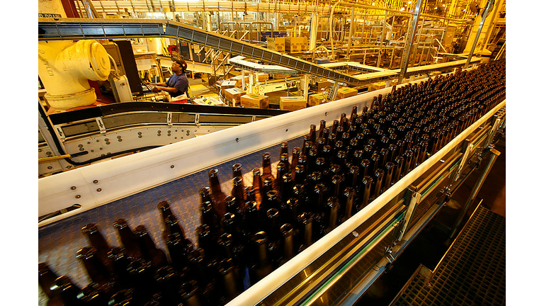 IRWINDALE, CA-JUNE 16, 2014:  A lowerator transports empty bottles from the second level to the firs