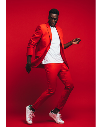 Man dancing on red background
