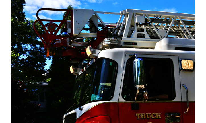 Close up of fire truck with overhead ladder