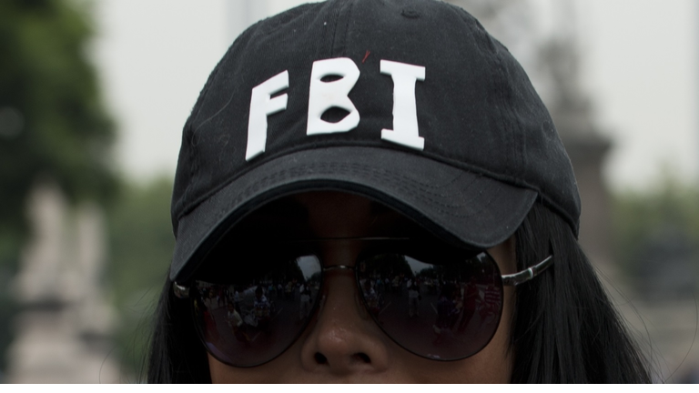 A member of the gay community wears a ha
