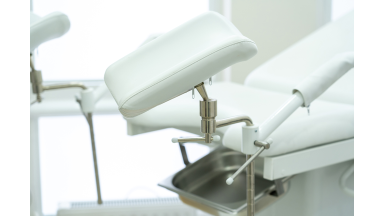 White gynecological chair in modern medical center