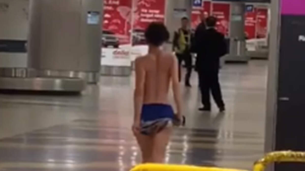 Naked woman attacks Chilean airport passengers after taking