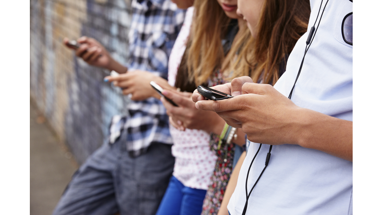 Teenagers using cellphones