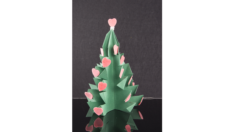 Christmas origami tree. More and more people are using their mobile phones to learn how to do crafts