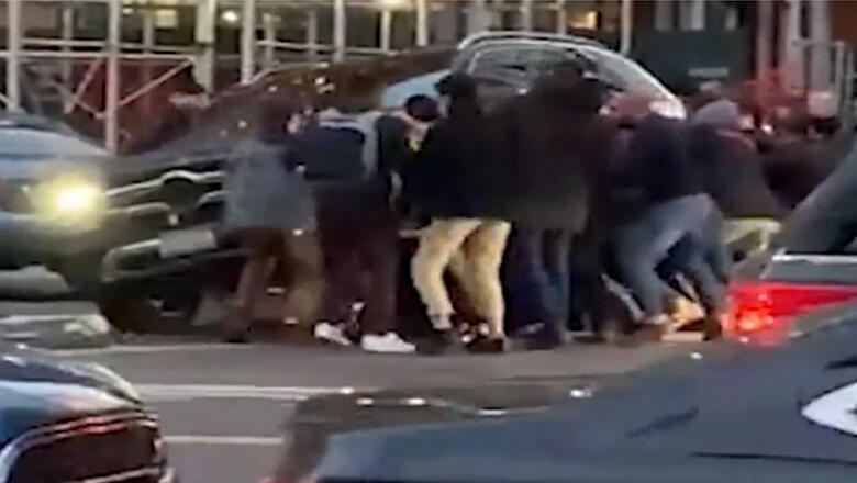 Video Shows Good Samaritans In New York City Lifting SUV Off Trapped Woman - Thumbnail Image