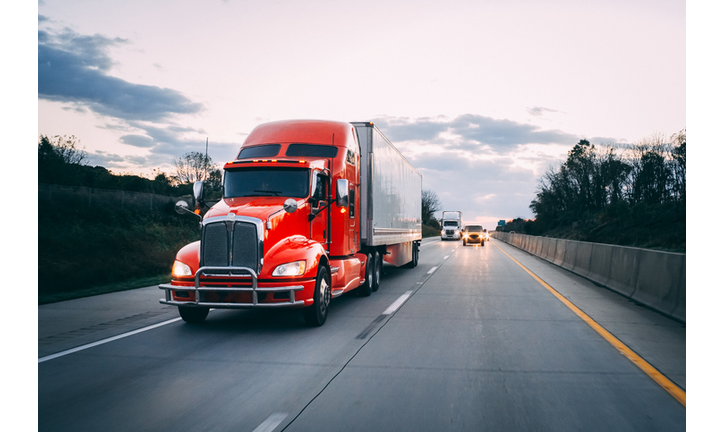 18 wheeler semi-truck on the highway at night