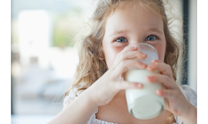 Girl drinking glass of milk