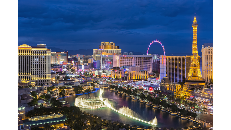 USA, Nevada, Las Vegas, Strip, fountain, hotels and Eiffel Tower at blue hour