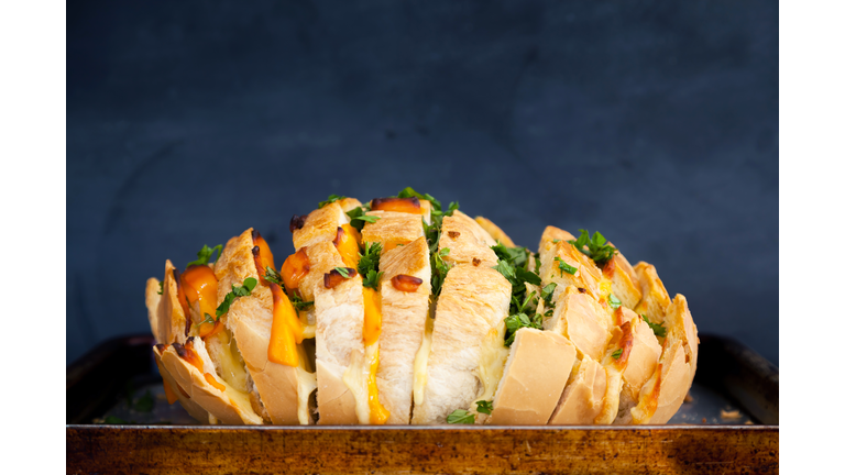 Cheesy garlic bread with fresh herbs/Getty Images