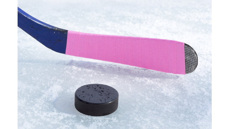 ice hockey stick and puck