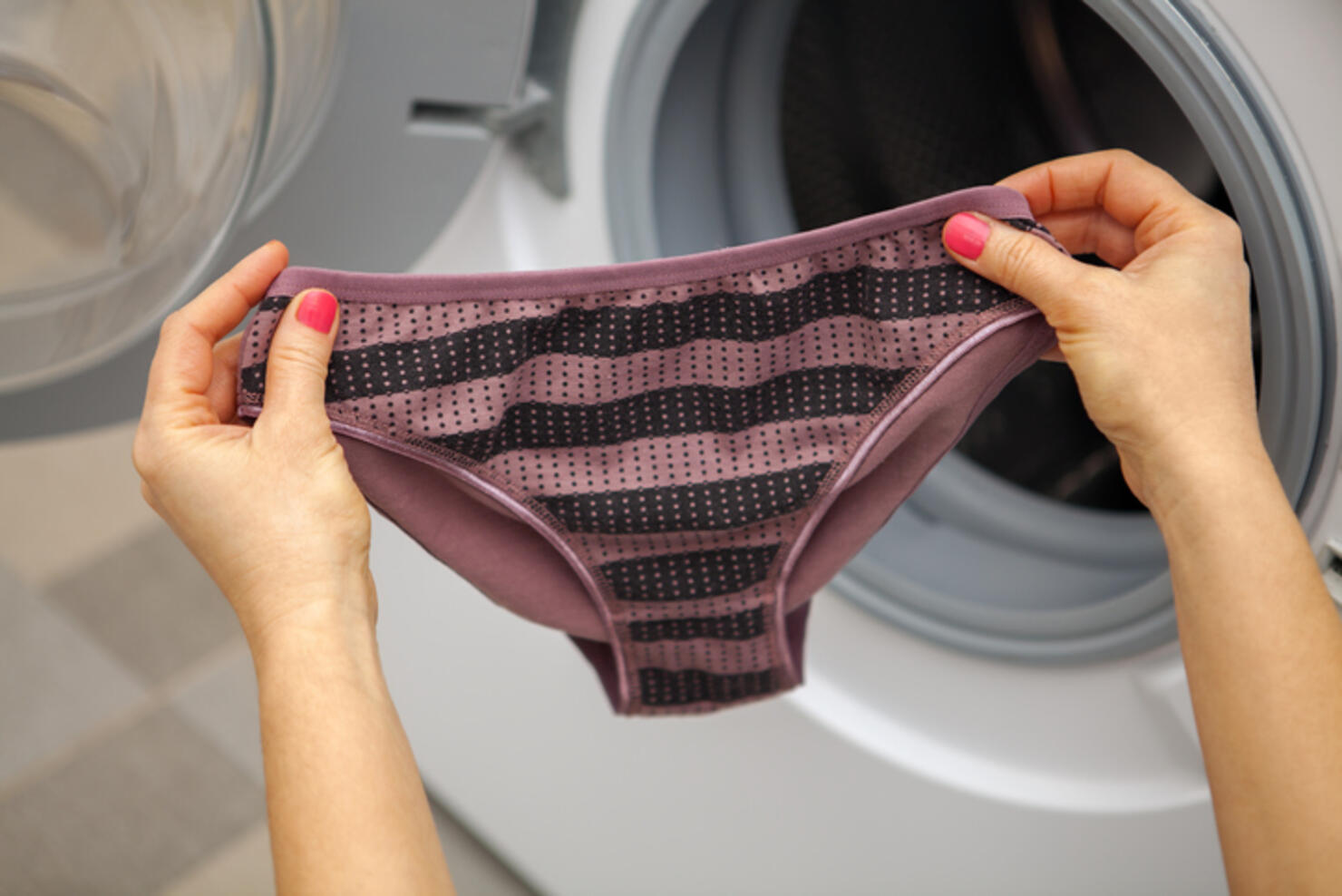 woman holding panties