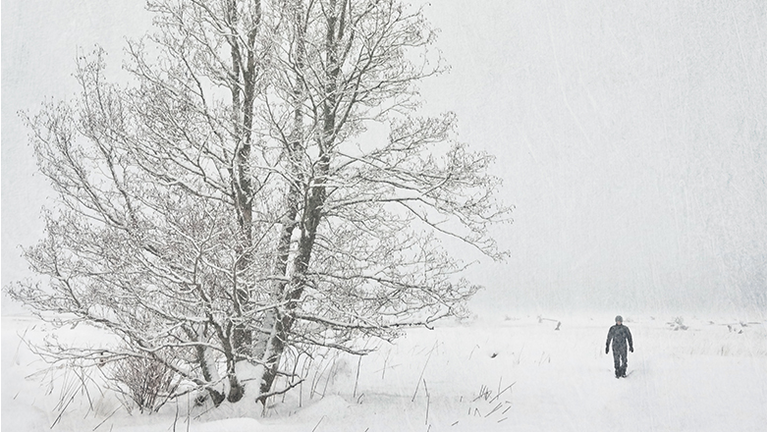 Person walking in snowstorm