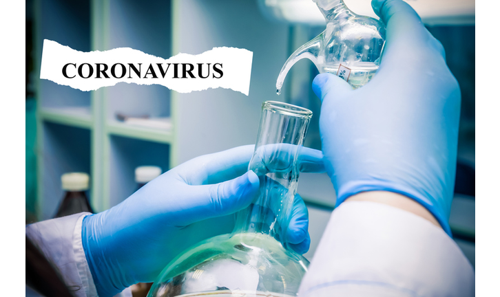 chemist in blue gloves holds a glass dish for experiments in his hand, pours a liquid solution, and analyzes the reaction using different versions of reagents using chemical production. close up