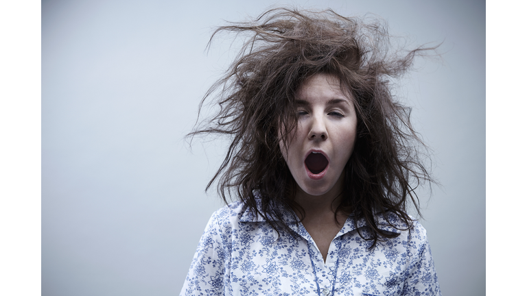 Young woman yawning, close up