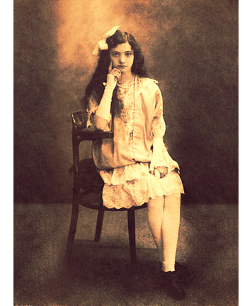 Vintage girl sitting in front of the camera