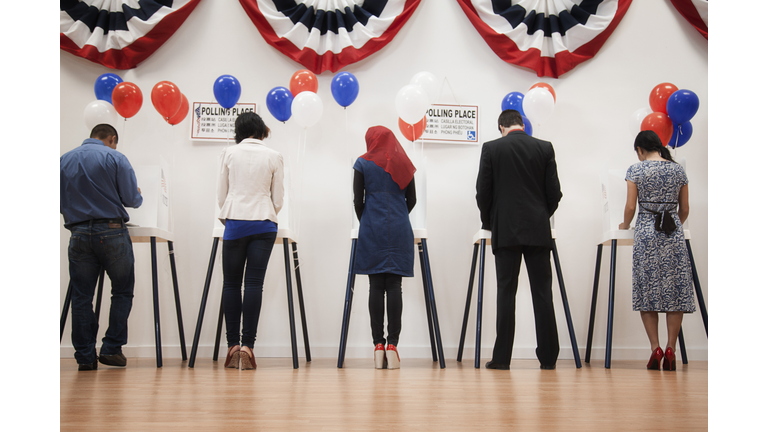 Voters voting in polling place