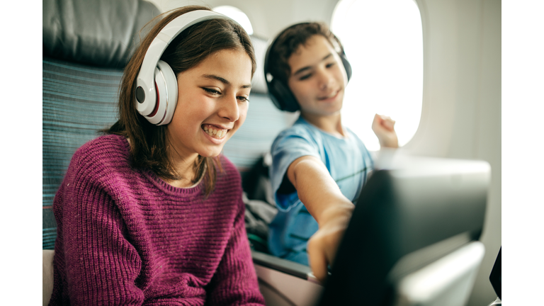 Kids Watching TV On Plane