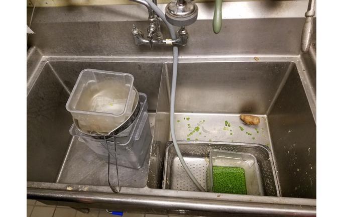 High Angle View Of Kitchen Utensils In Sink